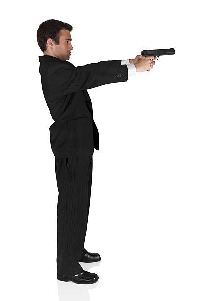 320 Man Holding Gun Side Profile Stock Photos Pictures And Royalty Free