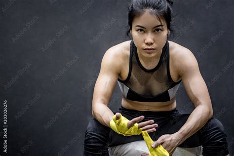 Asian Female Boxer Wearing Yellow Strap On Wrist Beautiful Young Woman