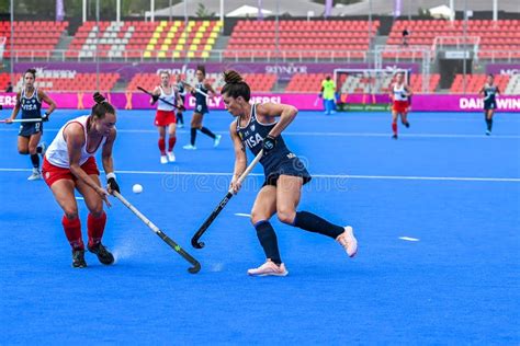 players in action in the argentina vs canada field hockey match at the fih hockey womens world
