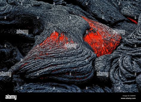 Molten Lava Rock That Glows From Its Extreme Heat Flows From An