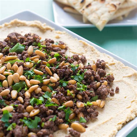 This is good as far as the tlavorings go although i would add a teaspoon or two of harrisa (can be found in most middle eastern stores) and prefer my lamb in chunks rather than ground. Hummus with Ground Lamb and Toasted Pine Nuts Recipe | LEBANESE RECIPES