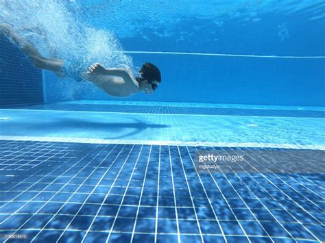 Happy Boy Jumped Into Swimming Pool High Res Stock Photo Getty Images