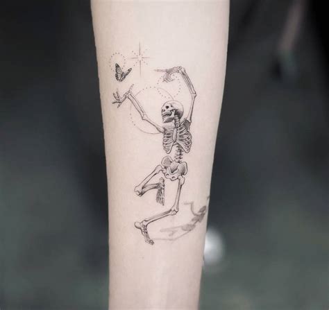 Dancing Skeleton Tattoo Located On The Inner Forearm