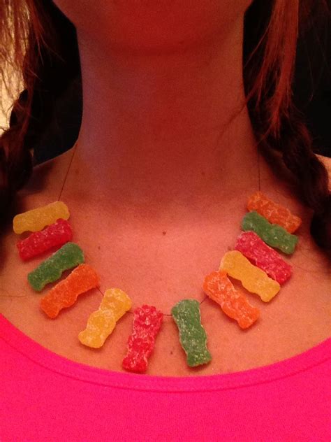 A Woman Wearing A Necklace Made Out Of Gummy Bears