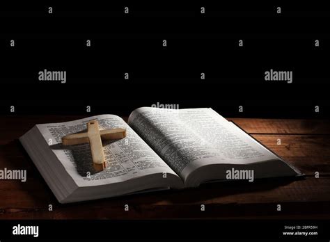 Russian Open Holy Bible With Wooden Cross On Table Stock Photo Alamy