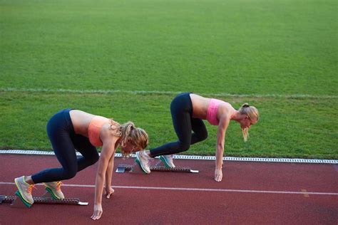 Athlete Woman Group Running On Athletics Race Track 12652491 Stock