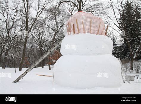 A Giant Snowman Being Built Stock Photo Alamy