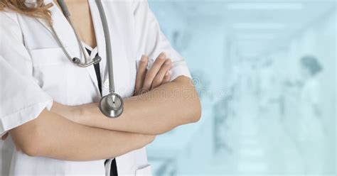 Half Body Photo Of Female Doctor No Face Standing With Arms Folded