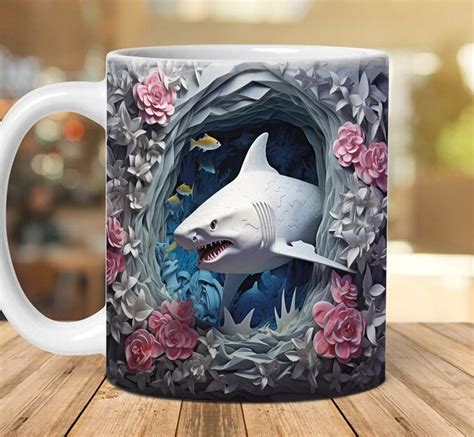A Coffee Mug With A Shark And Flowers On It