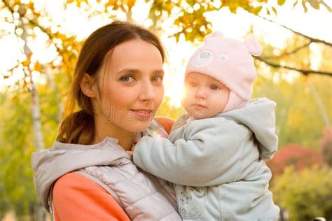 Young Mother With Her Children In The Park Autumn Stock Image Image