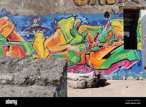 Graffiti On German Ww2 Bunkers Lie On The Beach Between Montalivet And