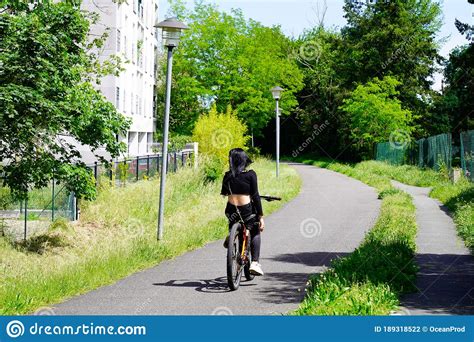 Girl Brunette Ride On Bike Path In Saint Medard En Jalles France Stock