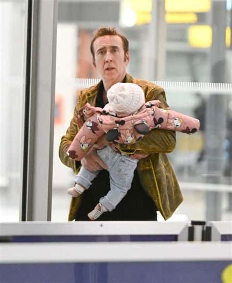 Nicolas Cage 59 Grins As He Carries Seven Month Old Daughter With