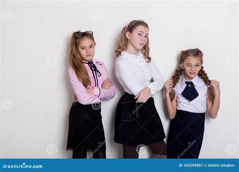 Three Beautiful Girls At The School Board In Class In Class Stock Image