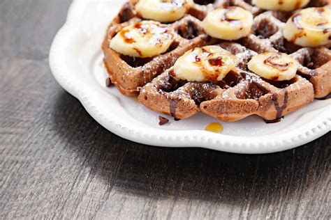 Chocolate Belgian Waffles With Banana And Syrup
