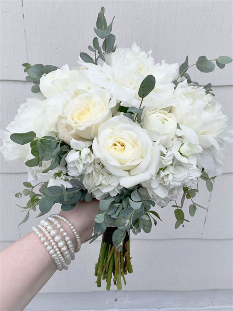 Maybe you would like to learn more about one of these? Elegant white bridesmaid's bouquet composed of peonies ...