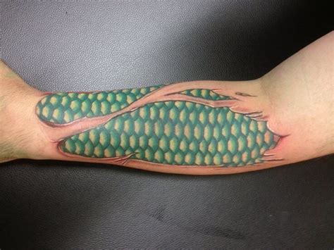 16 Snake Skin Tattoo Designs And Ideas Petpress Ripped Skin Tattoo