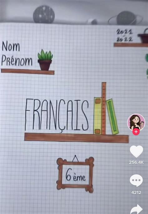 The French Language Is Written On A Notebook With Stickers And Magnets Attached To It