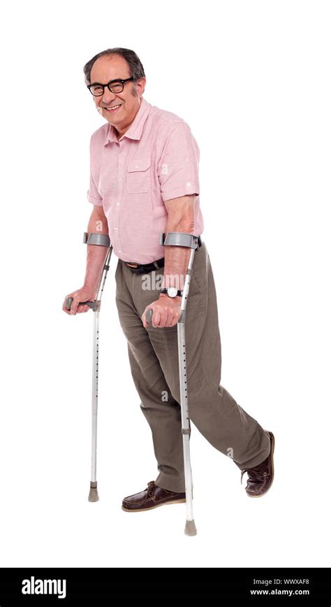 Man With Crutches Over White Background Hi Res Stock Photography And