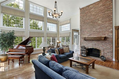 This Two Story Living Room Effortlessly Fuses Traditional