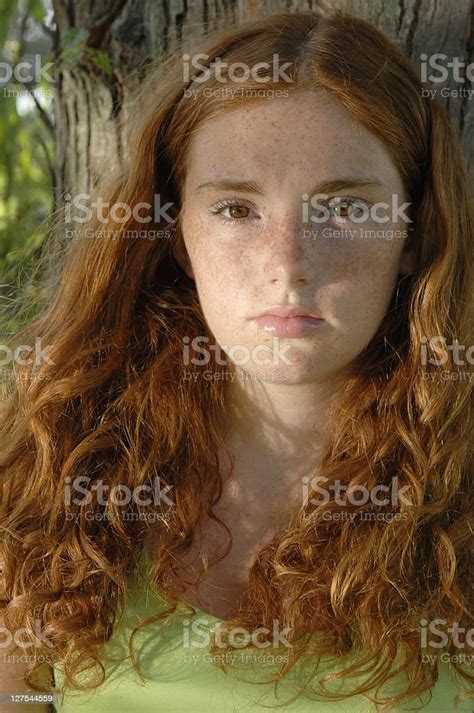 Girl Leaning Against Tree Stock Photo Download Image Now Redhead