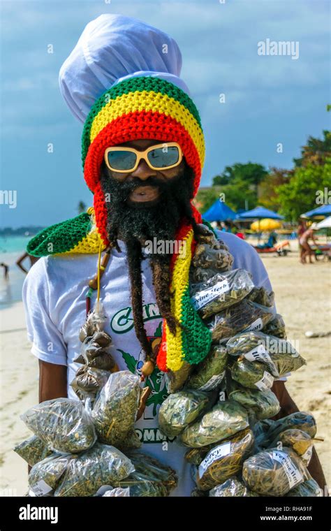 negril jamaica july 13 2014 jamaican rastafarian man selling herbs on the beach in negril