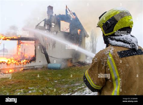 Norwegian First Responder Firefighter From Behind Trying To Put Out