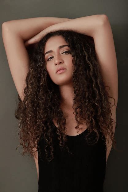 Premium Photo Portrait Of Beautiful Latina Girl With Curly Hair