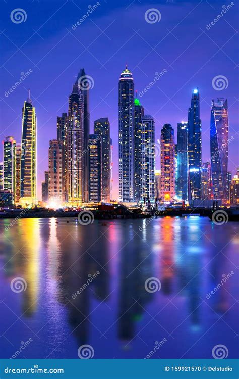 Dubai Marina Skyline At Night With Water Reflections United Arab