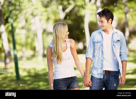 Couple Walking In Park Stock Photo Alamy