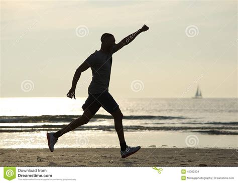 Running Man With Arm Raised In Celebration Stock Photo Image Of