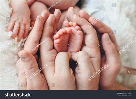 Newborn Babys Feet Mother Father Holding Stock Photo 1594436665