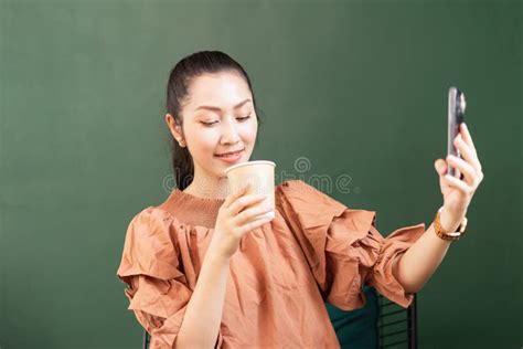 Beautiful Asian Woman Customer Drinking Hot Coffee While Taking Selfie