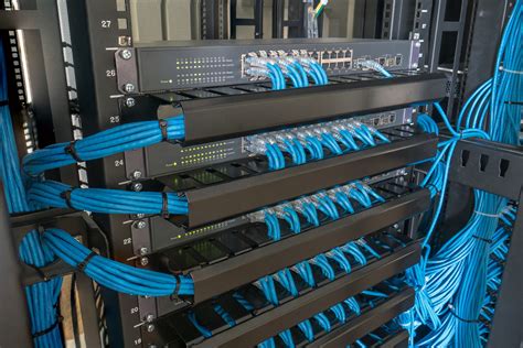 Network Switch And Ethernet Cables In Rack Cabinet Rtc Business Solutions