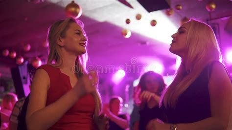 Party In A Nightclub Girls Dancing Smiling And Having Fun With