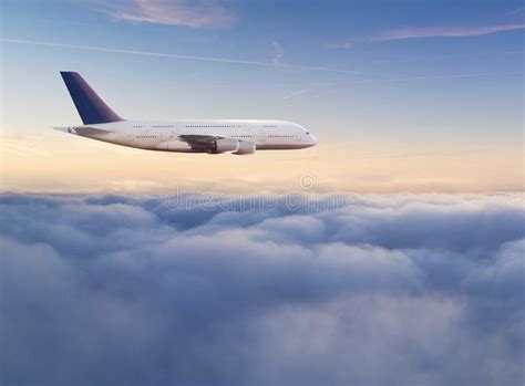 Passengers Commercial Airplane Flying Above Clouds Stock Photo Image