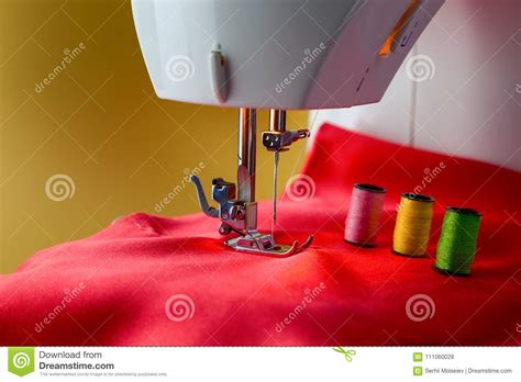 Spools Of Thread And Sewing Machine On A Red Cloth Stock Photo Image