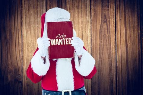 Premium Photo Santa Claus Presenting Card Against Vintage Help Wanted Sign