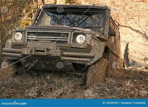 Competition Of Off Road Cars Suv Is Pulled Out From Puddle Of Mud By