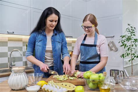 Premium Photo Mom And Teen Daughter Cooking Apple Pie Together At Home Kitchen
