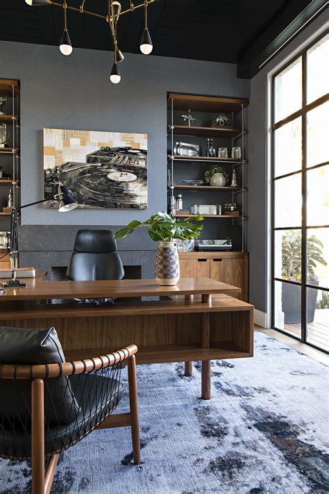 The Owners Home Office Has Custom Brass And Walnut Built Ins That House A Collection Of Machine