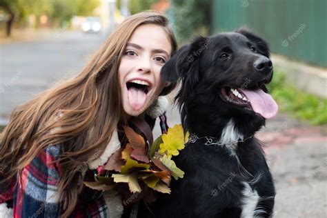 Premium Photo Happy Girl Gets Lovely Dog Plays And Embraces Humans
