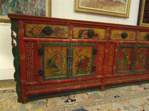 The painted finish has achieved an incredible patina over the almost two centuries since its creation. Gorgeous Hand-Painted Chinese Sideboard Cabinet at 1stdibs