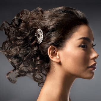 Raise your curly hair into a comfy and chic updo and add some fresh blooms. Wedding hairstyles for curly hair 2012 | MODE