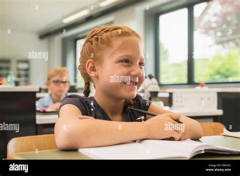 Schoolgirl Smiling In Classroom Fürstenfeldbruck Bavaria Germany
