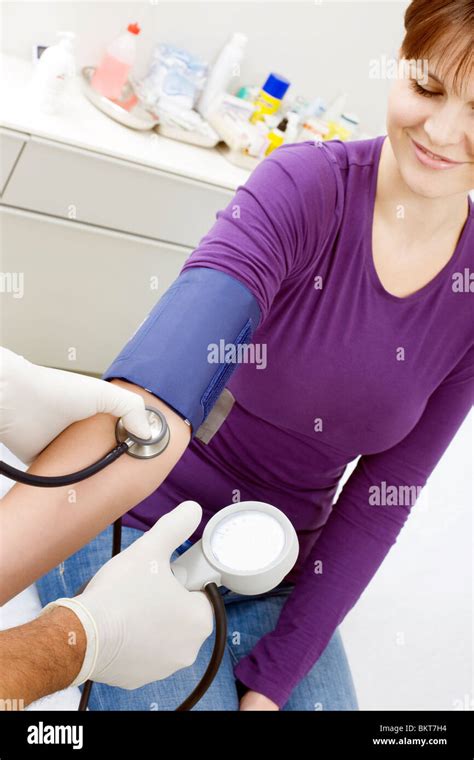 Doctor Measuring Blood Pressure Stock Photo Alamy