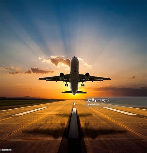Passenger Airplane Taking Off At Sunset High Res Stock Photo Getty Images