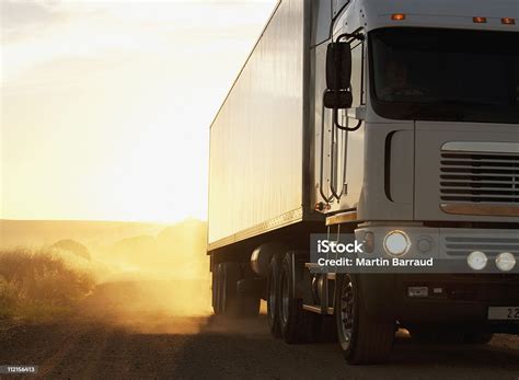 Semitruck Driving On Dusty Dirt Road Stock Photo Download Image Now