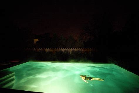 Nighttime Image Of A Girl Swimming Photograph By Woods Wheatcroft Pixels