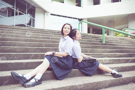 Cute Asian Thai High Schoolgirls Student Couple In School Leaning Stock